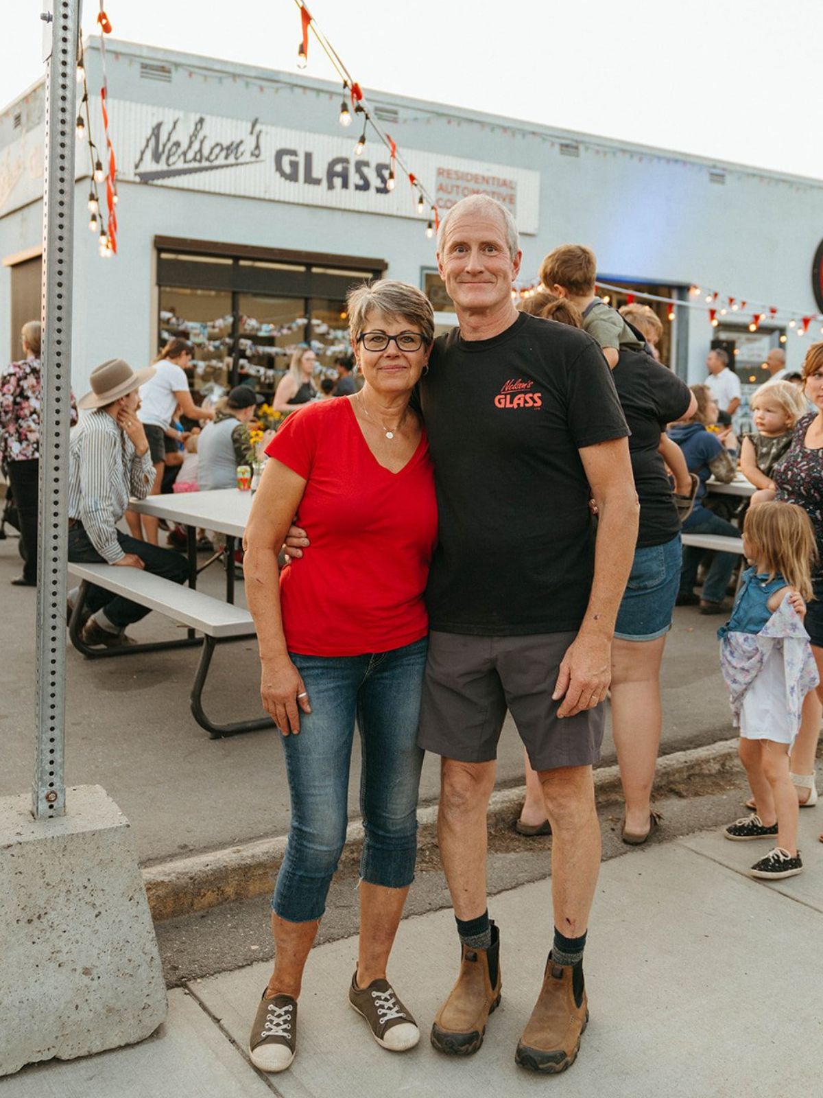 Pat and Debbe Nelson outside Nelson's Glass during a community evening in Armstrong, BC